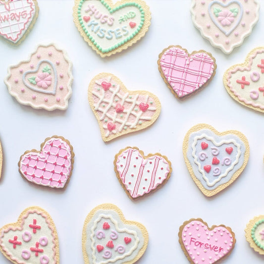 valentines day decorated cookies that say things like forever and hugs and kisses